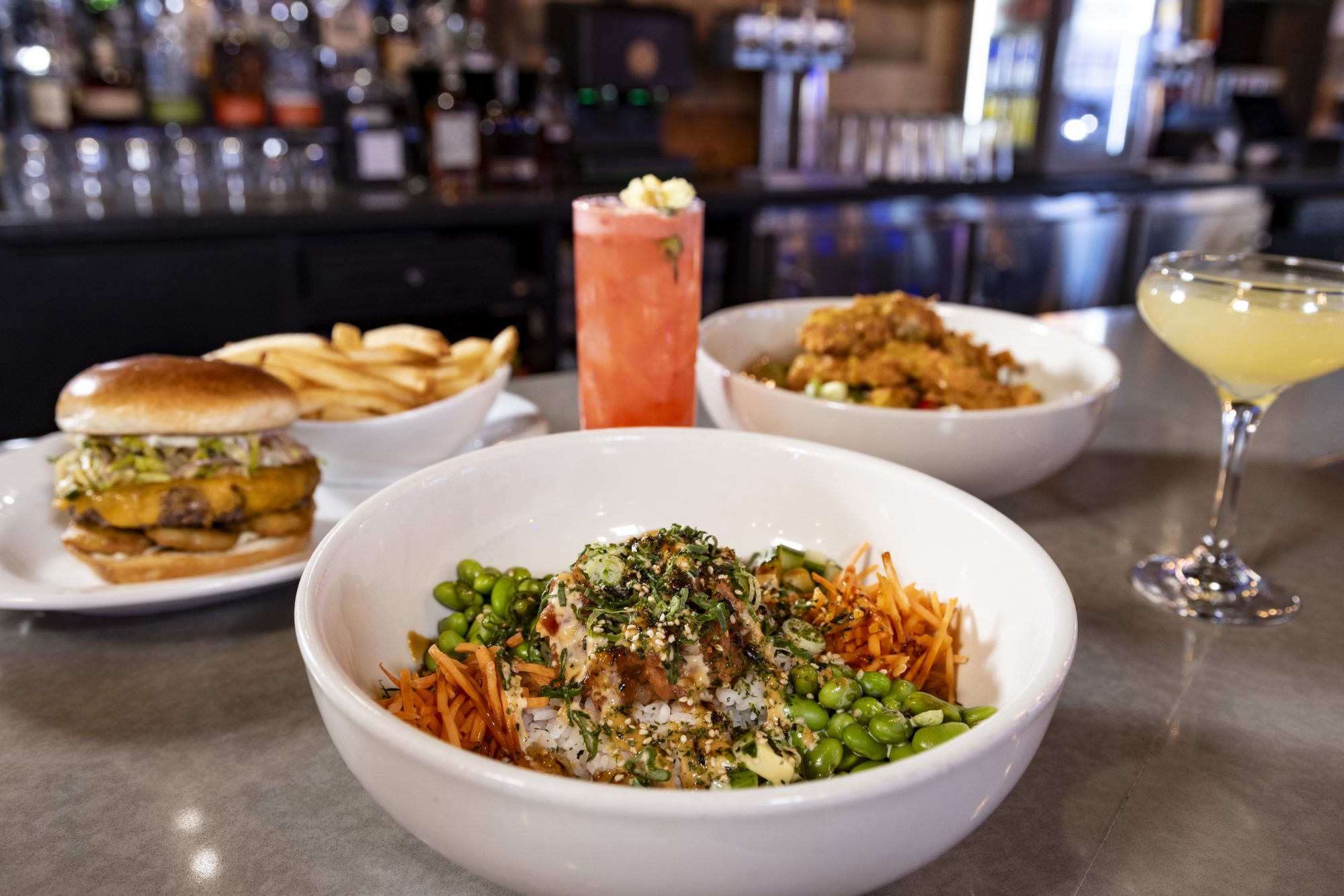  Spicy Tuna Bowl, Pickle Back Burgers, Cobb Chicken Salad, Cherry Blossom Limeade, and Passionfruit Daquiri food and drink menu items.